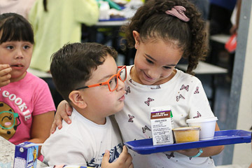 Kids hug kids. Maybe like them even more than food.