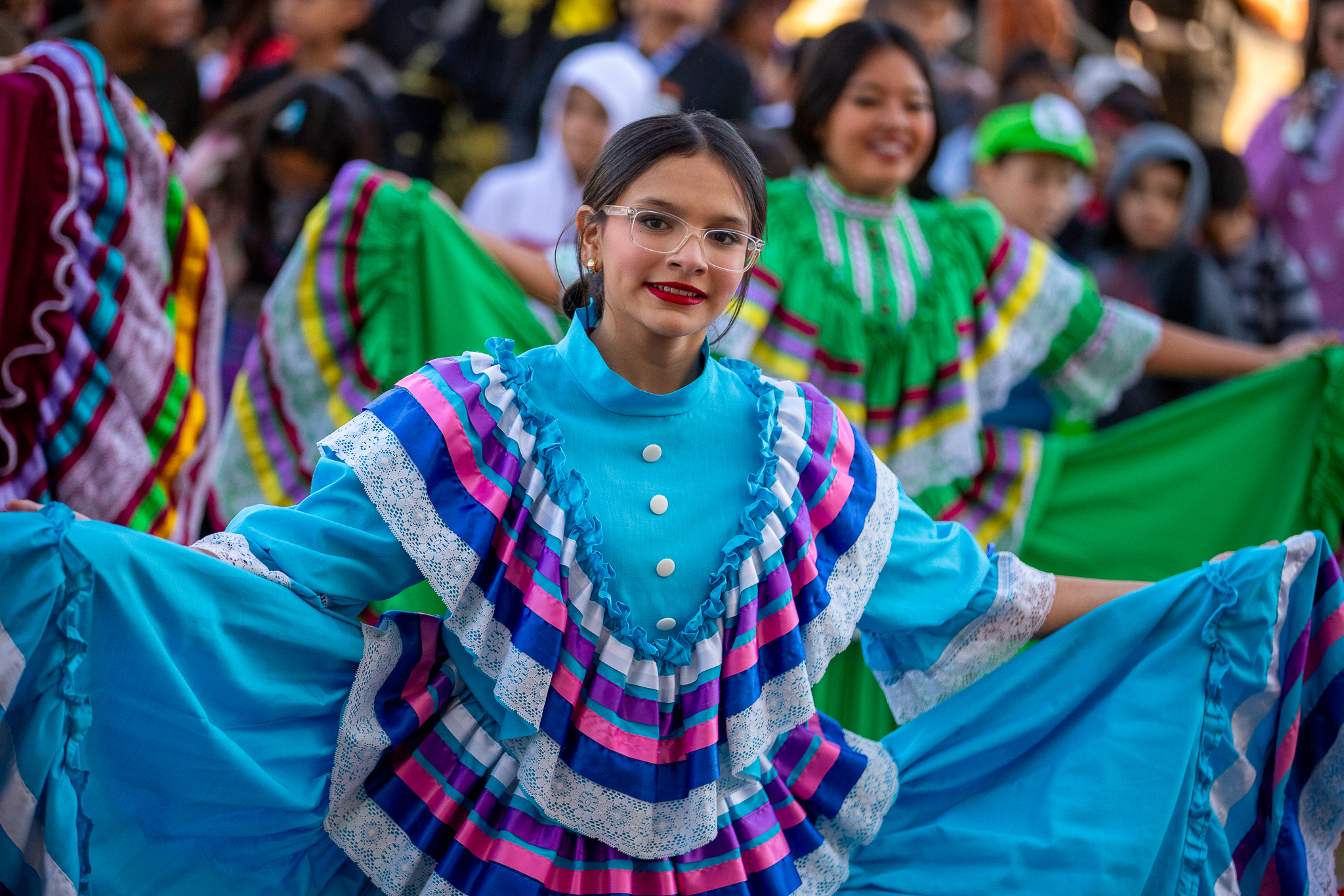 Folklorico dancers perform in brightly colored dresses