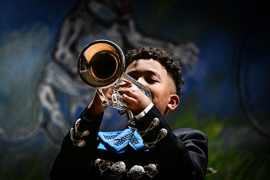 A boy plays the trumpet