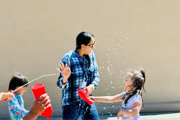 Students squirt their teacher with ketchup bottles filled with water